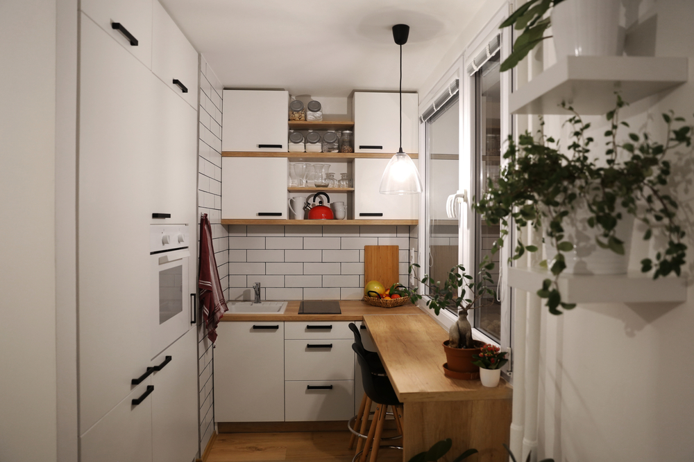 White kitchen with red components, cosy tine house